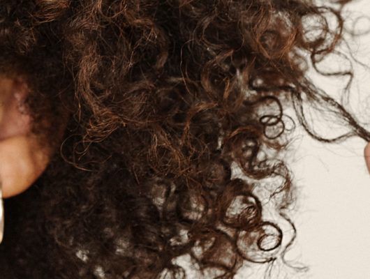 woman-pulling-curl-ringlet